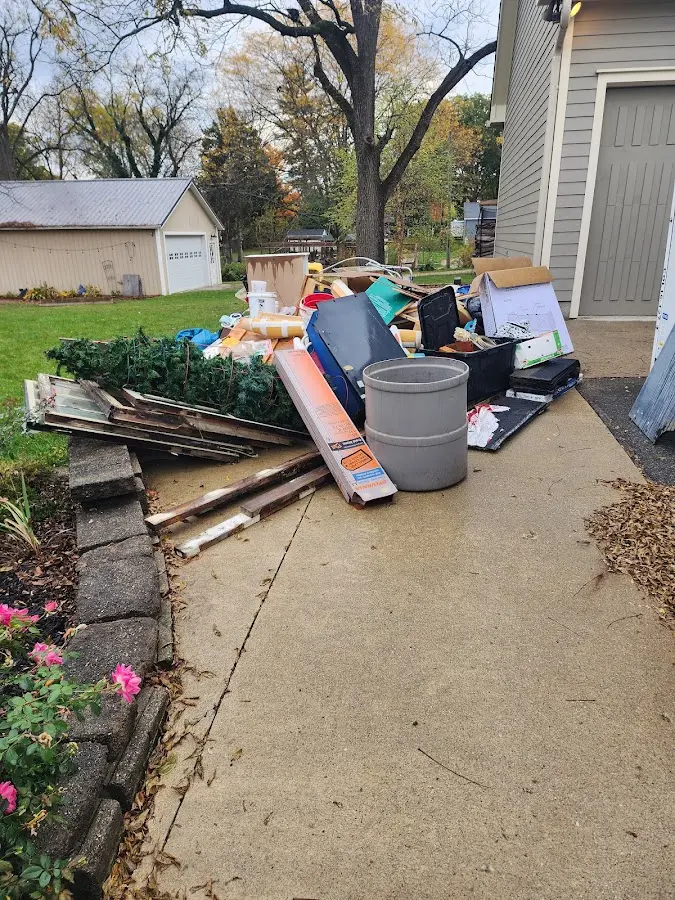 Dumpster being loaded with debris for 30 Yard Dumpster Rental in Big Flats